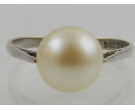 A 9 carat white gold and pearl set ring. 