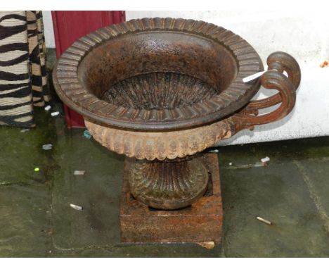 A Grecian style Victorian cast iron garden urn, on pedestal base. H.51cm