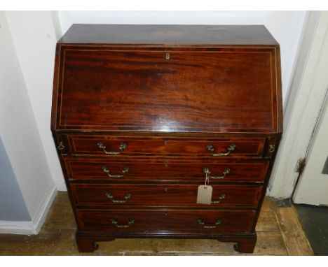 A George III bureau, the top centred with shell marquetry patterae, the full enclusing a fitted interior above four graduated