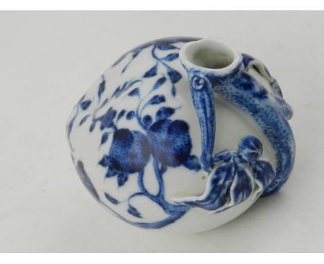 A Chinese blue and white porcelain vase, moulded with scrolling foliage and painted with flowers, bears seal mark to base. H.