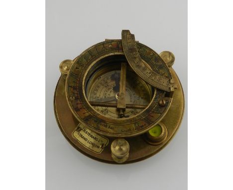 A brass compass and sundial. 