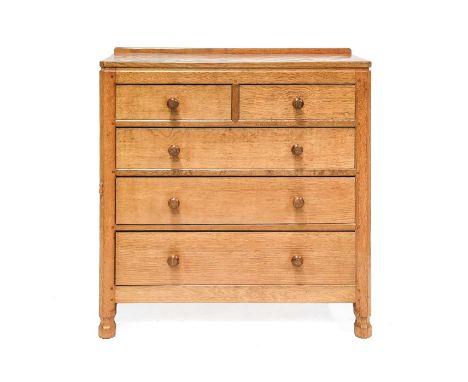 Workshop of Robert Mouseman Thompson (Kilburn): An English Oak Panelled Chest of Drawers, with raised upstand, above two shor