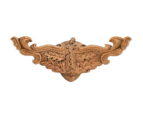 Workshop of Robert Mouseman Thompson (Kilburn): A Carved English Oak Double Wall Light Bracket, with scrolling arms, oak leaf