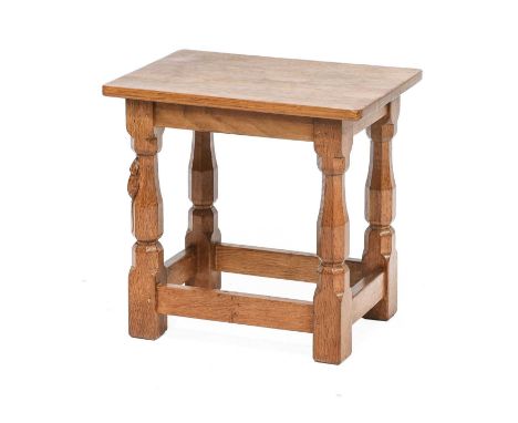 Workshop of Robert Mouseman Thompson (Kilburn): An English Oak Stool, with solid top, on four octagonal legs joined by rails,