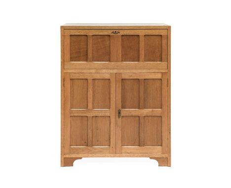 Acorn Industries: G.J.Grainger and Son (Brandsby): A Fumed Oak Bureau, the rectangular top above a fitted interior, fall fron