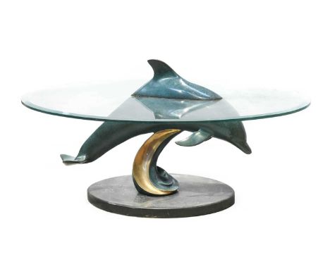 Douglas Wylie (American, 1952): Bow Rider, 1995, patinated bronze dolphin table, with oval bevel edged glass top, signed unde