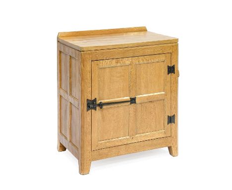 Rabbitman: Peter Heap (Wetwang): An Oak Panelled Bedside Cupboard, with raised upstand, above a single door enclosing a fixed