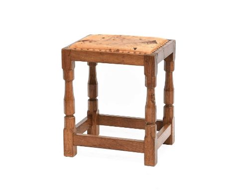 Workshop of Robert Mouseman Thompson (Kilburn): An English Oak Dressing Table Stool, with upholstered cow hide leather seat, 