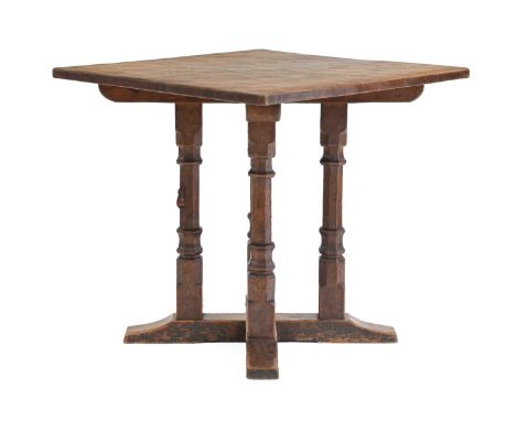 Robert Mouseman Thompson (1876-1955): An English Oak Table, adzed two plank top, on four carved faceted octagonal legs joined