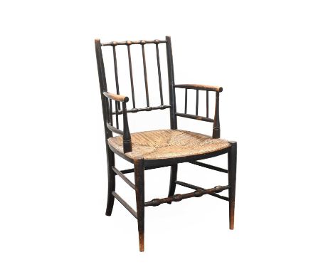 An Arts &amp; Crafts Sussex Style Ebonised Beech Chair, circa 1900, with bobbin turned and spindle back, rush seated, bobbin 