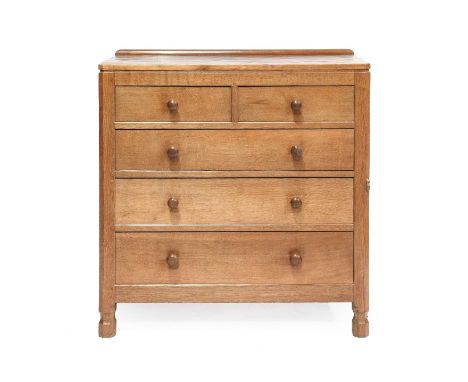 Workshop of Robert Mouseman Thompson (Kilburn): An English Oak Panelled Chest of Drawers, with raised upstand, above two shor