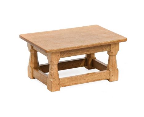 Workshop of Robert Mouseman Thompson (Kilburn): An English Oak Solid Top Stool, on four octagonal legs joined by rails, with 