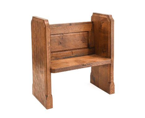 Workshop of Robert Mouseman Thompson (Kilburn): An English Oak Monks Bench, adzed, solid sides and seat, panelled back with b