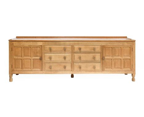 Foxman: Don Craven (Boroughbridge): An Oak Sideboard, with raised upstand, above two cupboard doors enclosing six drawers, wi