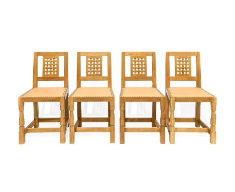 Workshop of Robert Mouseman Thompson (Kilburn): A Set of Four English Oak Lattice Back Dining Chairs, 1999, tan leather uphol