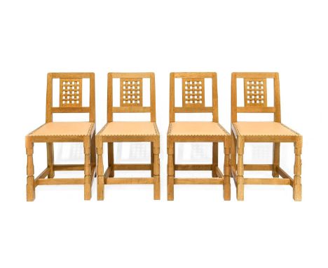 Workshop of Robert Mouseman Thompson (Kilburn): A Set of Four English Oak Lattice Back Dining Chairs, 1999, tan leather uphol