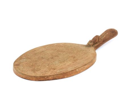 Workshop of Robert Mouseman Thompson (Kilburn): An English Oak Cheese Board, post 1960, of standard form, with carved mouse t