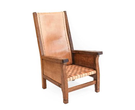 Robert Mouseman Thompson (1876-1955): An English Oak Smoking Chair, 1940s, slung leather back with woven leather seat, carved