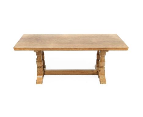 Workshop of Robert Mouseman Thompson (Kilburn): An English Oak 4ft Rectangular Coffee Table, on four octagonal legs joined by