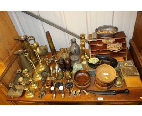A large quantity of brass and wooden ware to include candlesticks; busts; a stationery rack; a pair of partridge ornaments; e