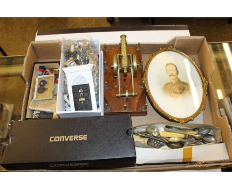 A box containing a canon ornament, cutlery, portrait of a WW1 soldier, a silver fob medal, three WW2 medals etc.