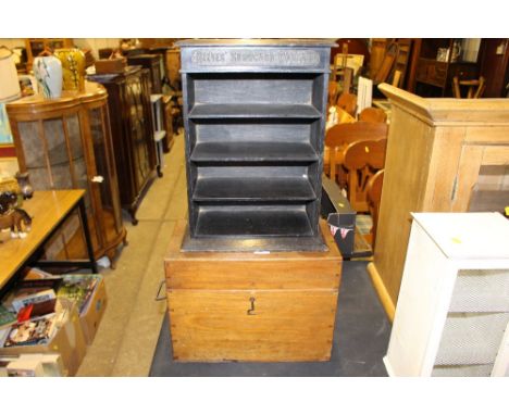 A mahogany storage box and a small black painted advertising shelf 'Reeves Show Card Colours'