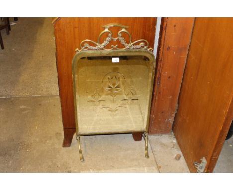 A brass and mirrored glass firescreen