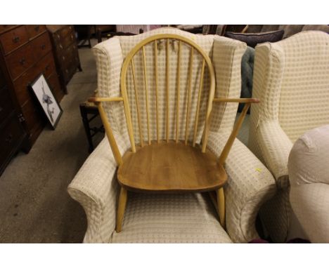 A blonde Ercol stick back armchair