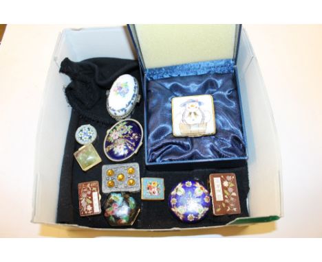 A box of enamel decorated and other pill boxes