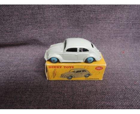 A Dinky diecast, 181 Volkswagen, Grey with light blue hubs, in original correct spot box