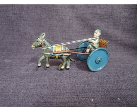 A Gama DRGM Germany tinplate and clockwork Donkey with Cart and Clown