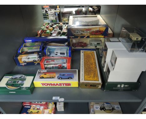 A shelf of modern Corgi diecasts including Transport of the 30's, British Motoring Classics of the 60's, Toy Master, Classics