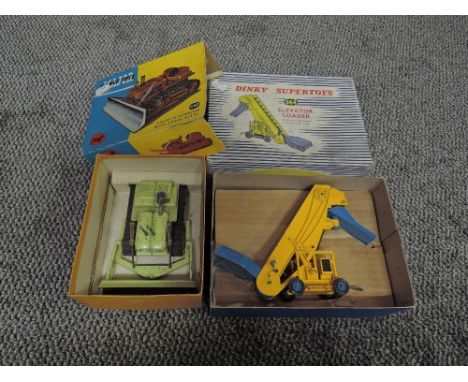 A Dinky Supertoy diecast, 964 Elevator Loader in yellow and blue in original blue and white striped box having card insert al