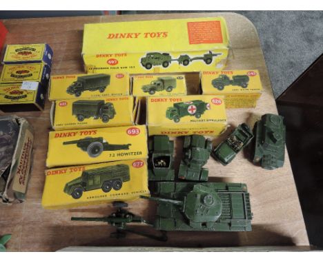 Fourteen Dinky Military diecasts, 697 25-Pounder Field Gun Set, 621 3-Ton Army Wagon, 623 Army Covered Wagon, 626 Military Am