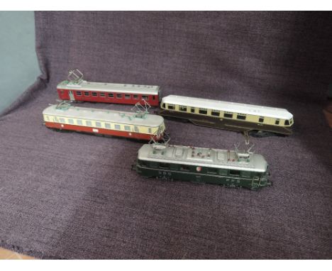 A Marklin HO scale SBB FFS Locomotive along with a Fleichmann HO scale Munchen Locomotive and resttaurant Car and a Lima GWR 