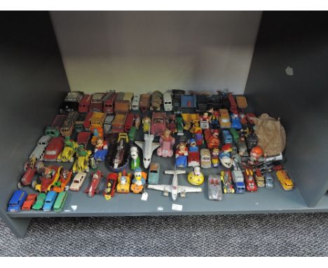 A shelf of playworn diecasts including Corgi Disney Series, Dinky Construction and Cars, Lesney, Britains etc along with Lead