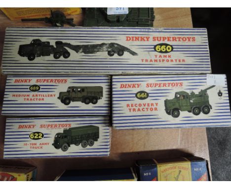 Four Dinky Military diecasts, 622 10-Ton Army Truck, 660 Tank Transporter, 661 Recovery Tractor having inner card insert and 