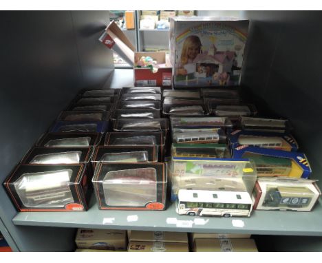 A shelf of EFE, Corgi and Day Gone diecast Buses and Advertising Vans, (30) all boxed