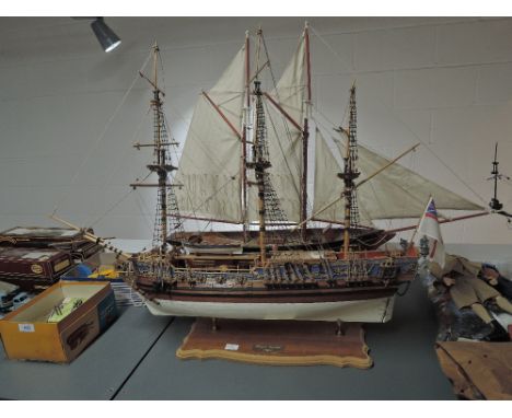 A wooden scale model of 1749 Royal Caroline British Royal Yacht, on wooden and brass display plinth along with a similar mode