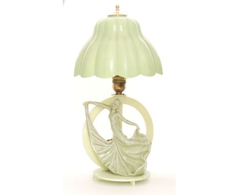 An Art Deco pottery green table lamp in the form of a dancer with shade, height 45cm