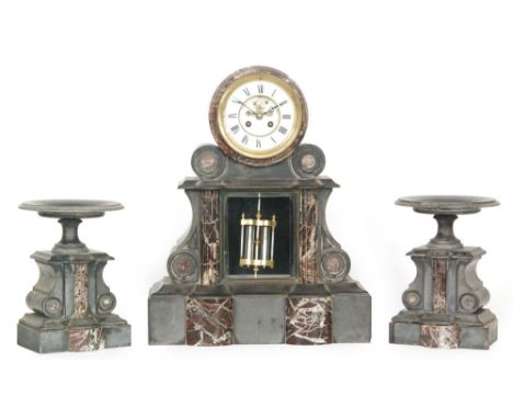 A late 19th Century French polished slate and rouge marble clock garniture, the clock with reeded pilasters and with visible 