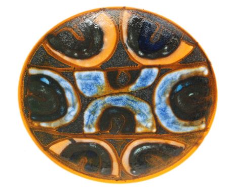 A Poole Pottery shape 4 shallow dish decorated with horse shoe motif in tones of orange and blue with textured glaze sections