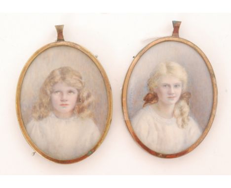 E.M.GRIFFIN, EARLY 20TH CENTURY - Portrait of a young girl wearing ribbons in her hair, miniature on celluloid, oval, signed,