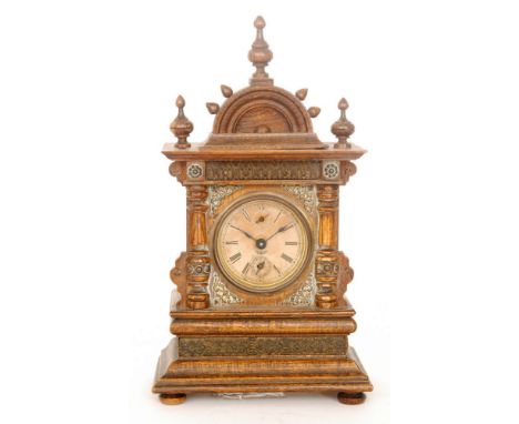 A late 19th to early 20th Century oak cased mantle clock, with pilaster columns and acanthus leaf spandrels to the case, heig