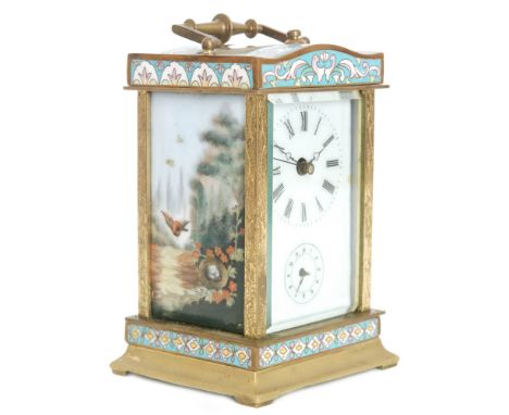 A 20th Century champleve enamel carriage clock, each enamel side panel detailed with a bird's nest amongst a landscape settin