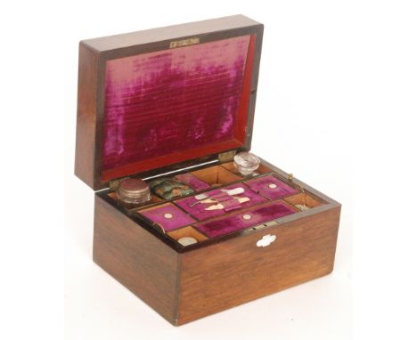 A Victorian rosewood veneered work box, the fitted interior with a lift-out tray and with a further fitted drawer to the base