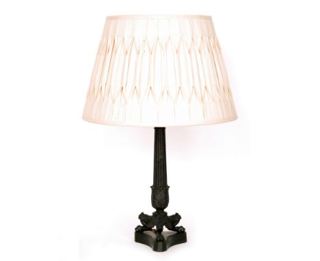 A 19th Century French Empire style bronze table lamp and shade on three paw feet and tricorn base, height 41cm