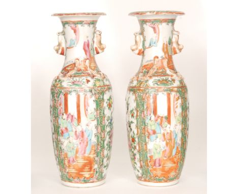 A pair of 19th Century Chinese Canton enamel famille rose vases of slender baluster form with collar necks decorated with app
