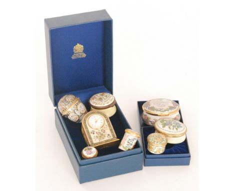 A Halycon Day enamelled miniature clock, an egg shaped box and six other boxes (8)