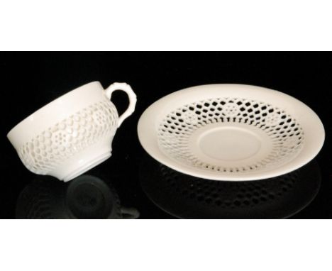 A late 19th Century Royal Worcester reticulated teacup and saucer in the manner of George Owen, the double walled teacup and 